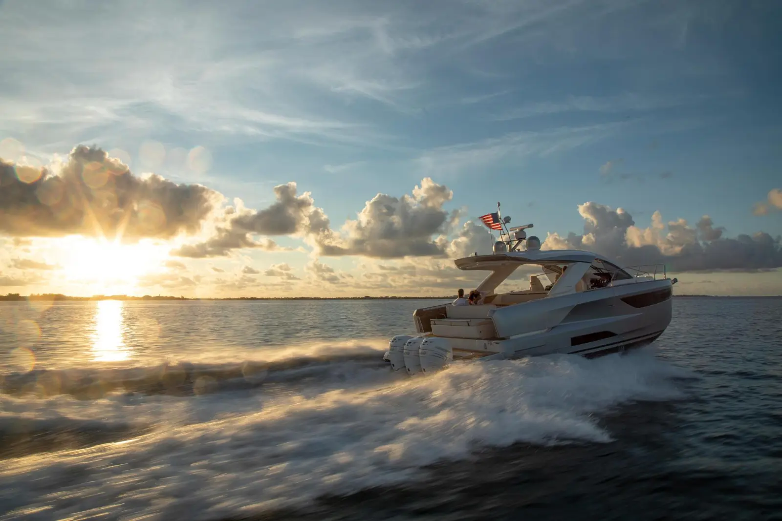 Luxury yacht cruising at sunset on pristine waters